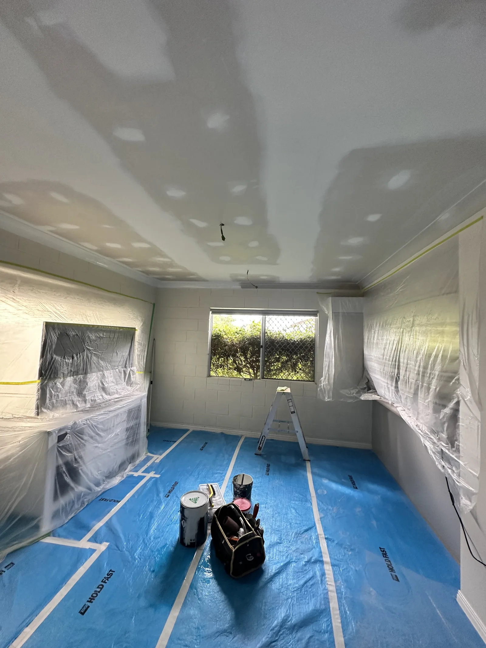 A living space before painting, prepped and ready