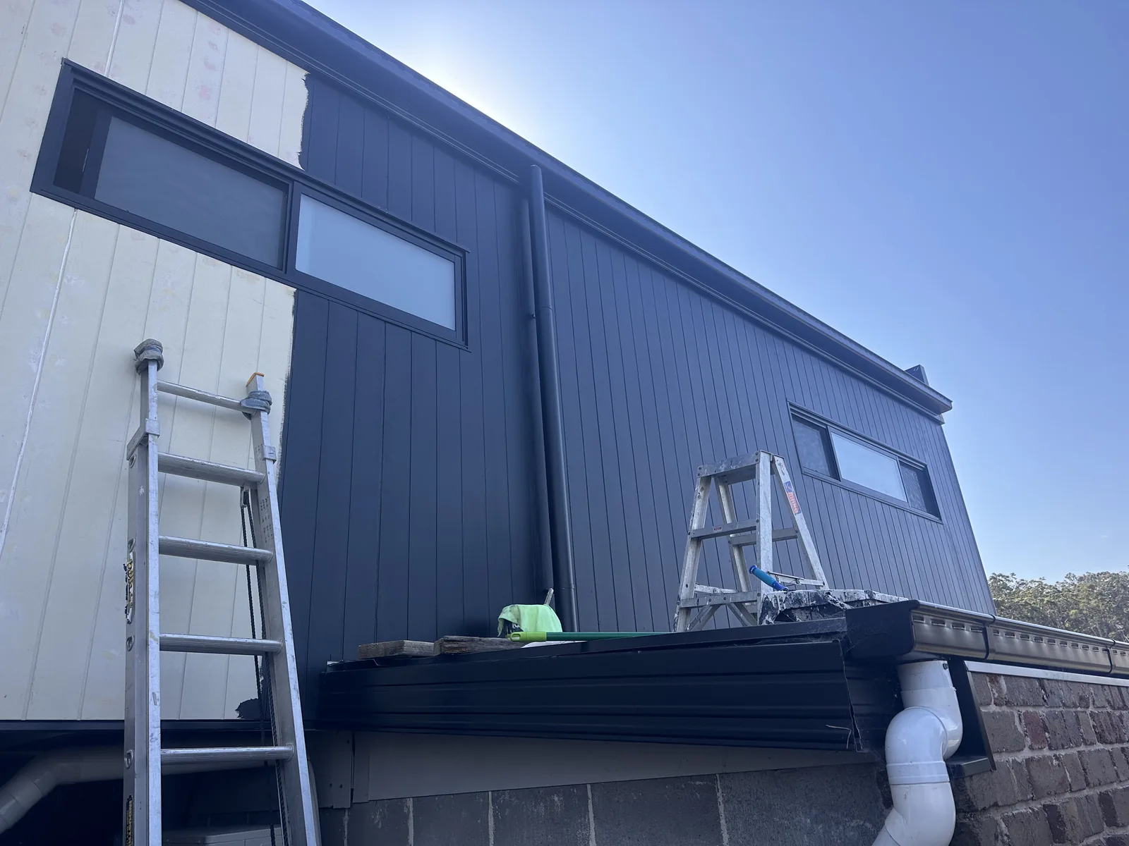 The same home exterior after a fresh finish