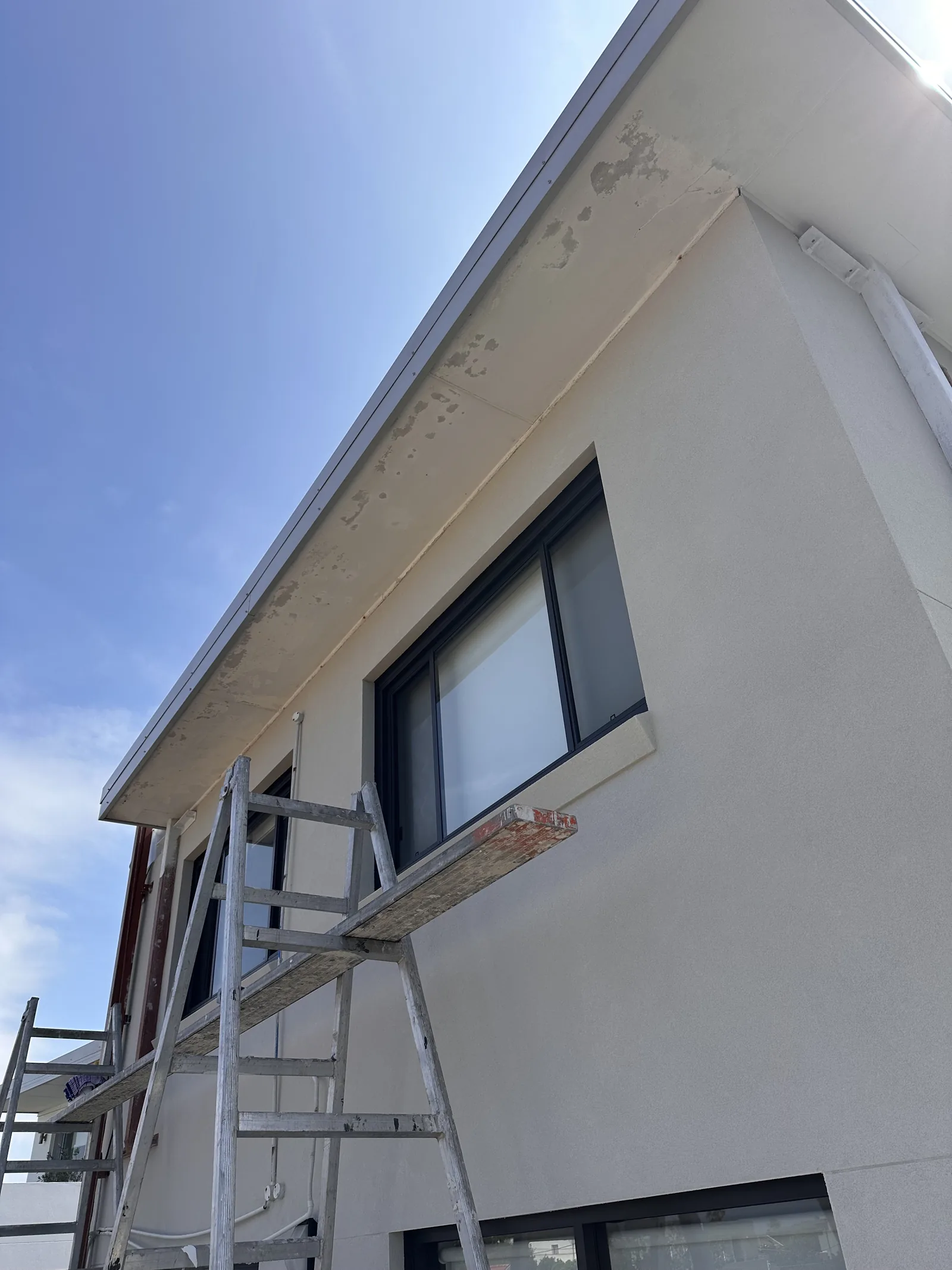 Exterior eaves and trim before repainting