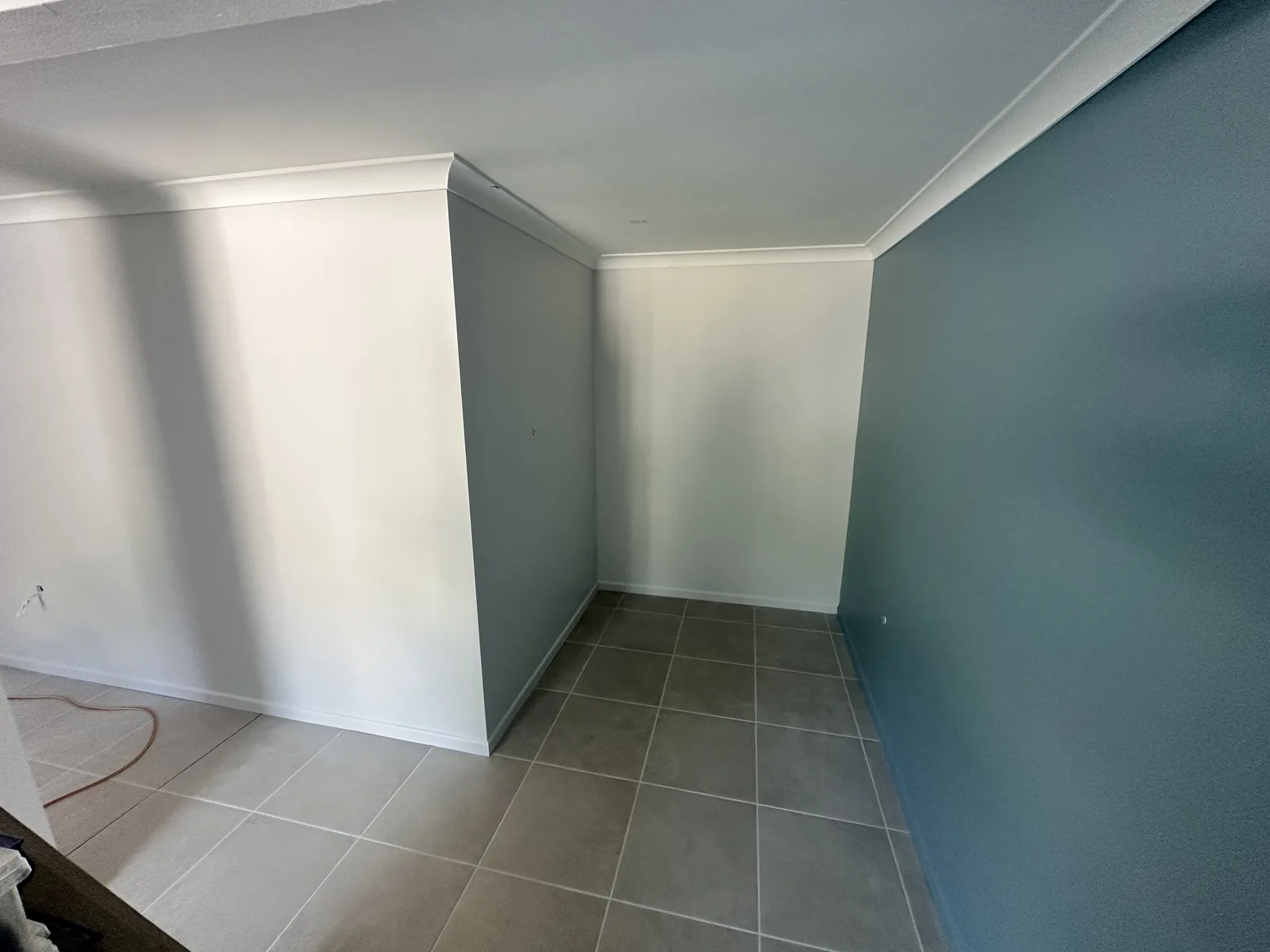 Interior wall painted in a soft teal finish